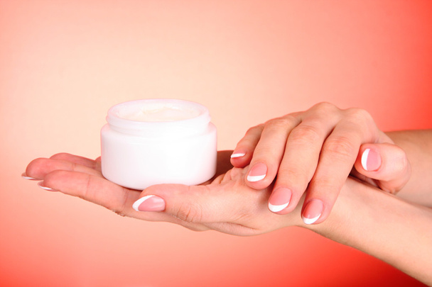 Woman applying cream on her hand - Foto, Bild