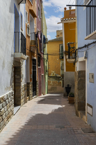 Villajoyosa street with multi-colored houses. Villajoyosa a coastal town in Alicante Province, Valencian Community, Spain, by Mediterranean Sea - Photo, image