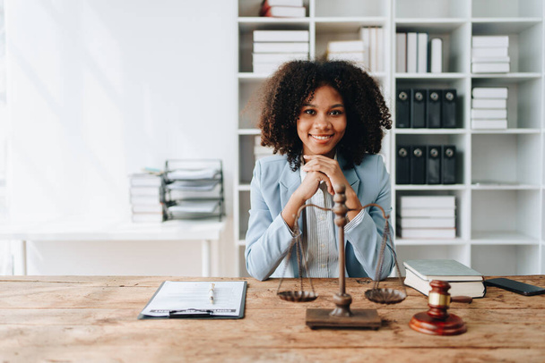 A young women African American lawyer lawsuit studying cases for clients in a law firm to fight against their parties in the courts. law and attorney concepts - Foto, Imagen