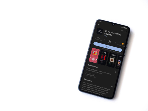 Lod, Israel - July 16,2023: TIDAL Music app play store page on smartphone on white background. Top view flat lay with copy space. - Valokuva, kuva