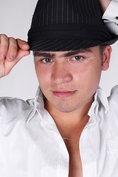 Portrait handsome fashion man in hat posing on white background - Фото, изображение