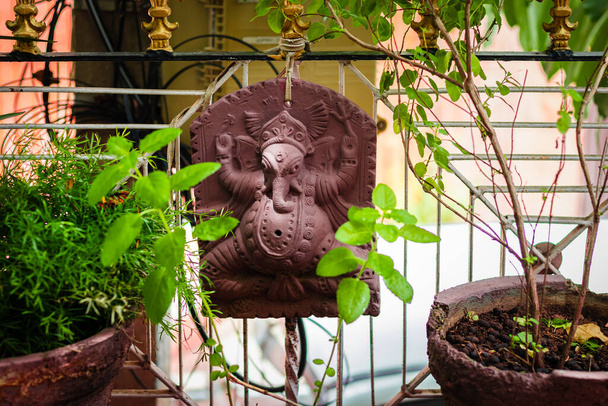 hindu god ganesha statue isolated at garden with tulsi tree for pray at day - Valokuva, kuva