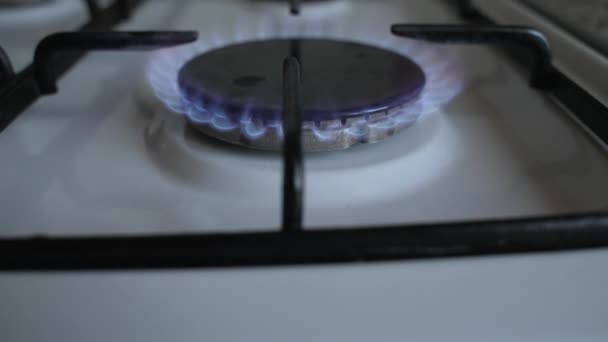 Ignite gas in a burner on a gas stove. Slow motion Dolly shot. Close-up - Footage, Video