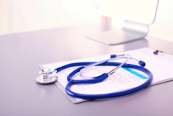Medical equipment: blue stethoscope and tablet on white background. Medical equipment. - Foto, immagini