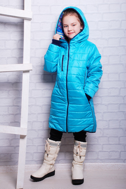 Little girl in autumn warm coat - Foto, imagen