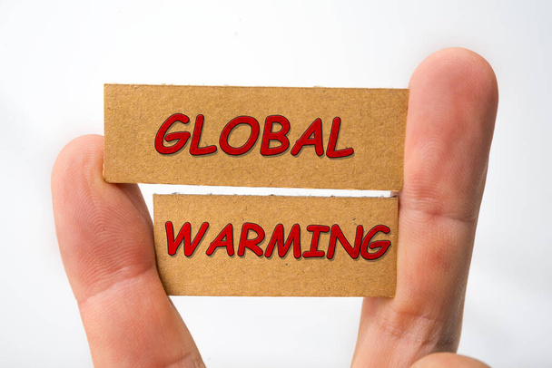 Глобальний знак потепління на картоні на білому - Фото, зображення