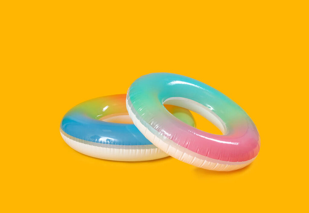 Inflatable rings on yellow background - Photo, Image