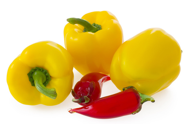 Three fresh yellow bell pepper and glass chilli peppers isolated on white - Photo, Image