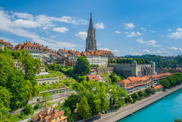 Aare river and Bern Minster, cathedral in the old city of Bern in Switzerland - Photo, Image