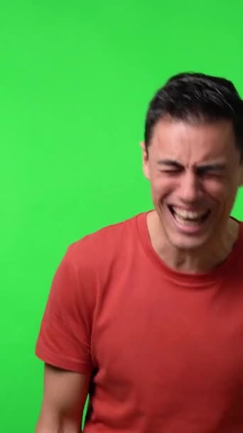 Man laughing out loud. With a red shirt. Medium shot. Chroma green background. - Footage, Video