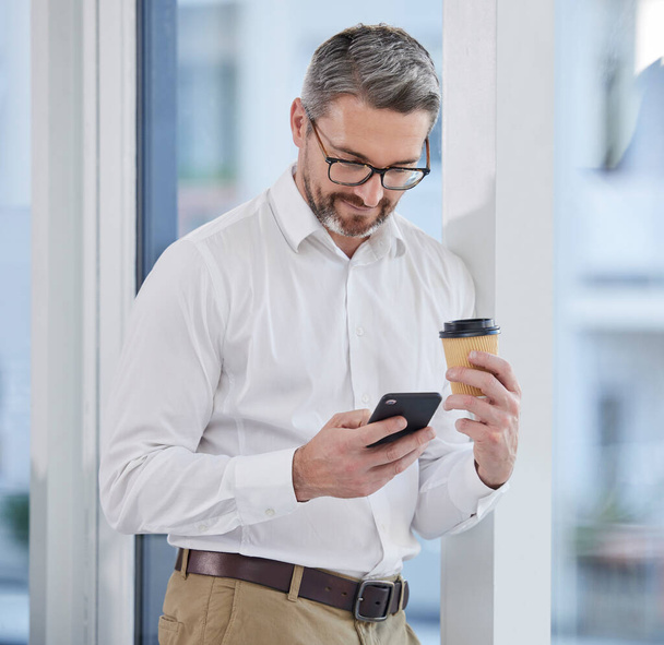 Phone, coffee and business man reading online, email communication or chat for corporate networking. Professional entrepreneur, CEO or senior person on mobile app, typing or search internet in office. - Foto, imagen