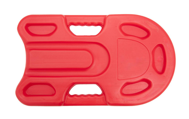 Плавальна дошка червоного кольору ізольована на білому тлі, безпека для дітей на морі та в басейні - Фото, зображення
