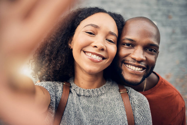 Face, interracial couple and selfie outdoor, happy and bonding together for memory in urban city. Portrait, smile and African man and woman with profile picture, photography and social media on date. - Photo, Image