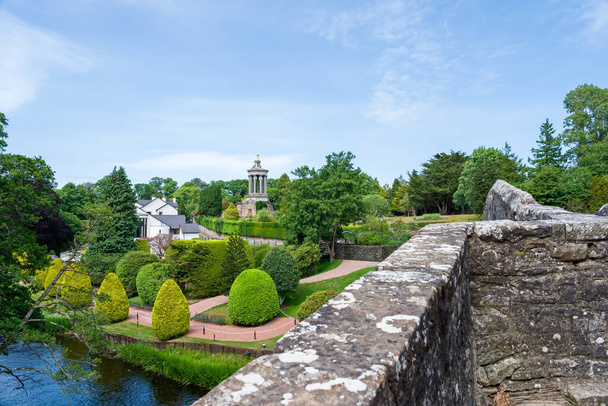 Burns Memorial and free gardens in Alloway near Ayr Scotland about to celebrate its 200th anniversary Image taken from the Auld Brig looking over to the gardens. - Photo, Image