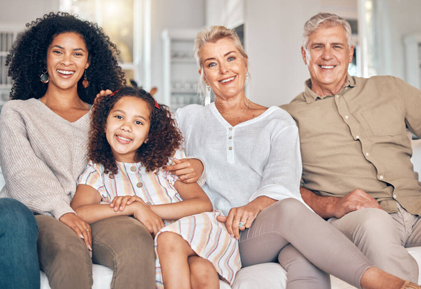Portrait, family and grandparents, kid and mother in home, bonding and relax together in living room. Interracial mom, grandpa and grandma with girl, smile and happy with care, love and quality time. - Photo, Image