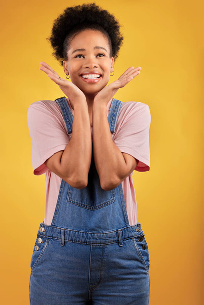 Thinking, choice and woman with a smile, decision and problem solving on a yellow studio background. Female person, opportunity or happy model with happiness, solution and ideas with wonder and emoji. - Foto, imagen