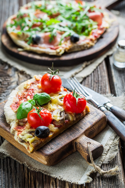 Close-up on a freshly split a pizza - Photo, Image