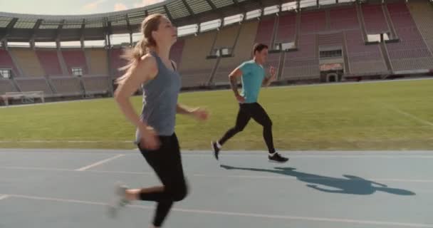 Young couple training at the stadium - Footage, Video