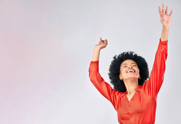 Happy black woman, dance and success in studio for freedom, celebrate party and winning bonus lottery with mockup space. Excited female model, celebration and dancing with energy on white background. - Foto, Imagem