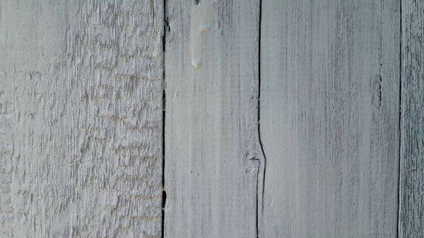 wooden background. old door painted grey color. wooden cracked boards close up. texture old boards - Foto, imagen