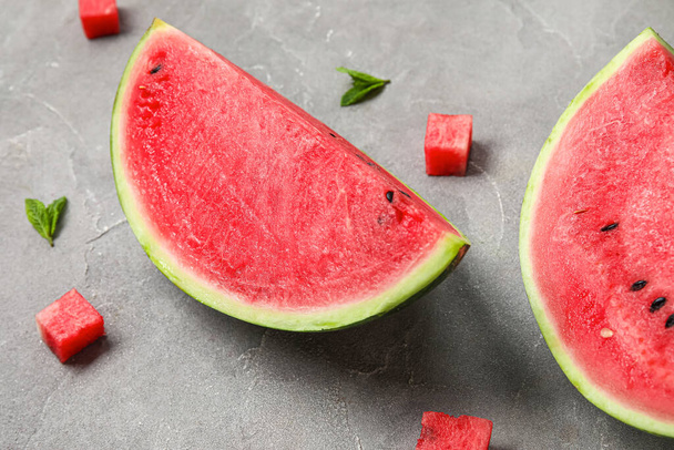 Composition with pieces of fresh ripe watermelon on grey background, closeup - Photo, Image