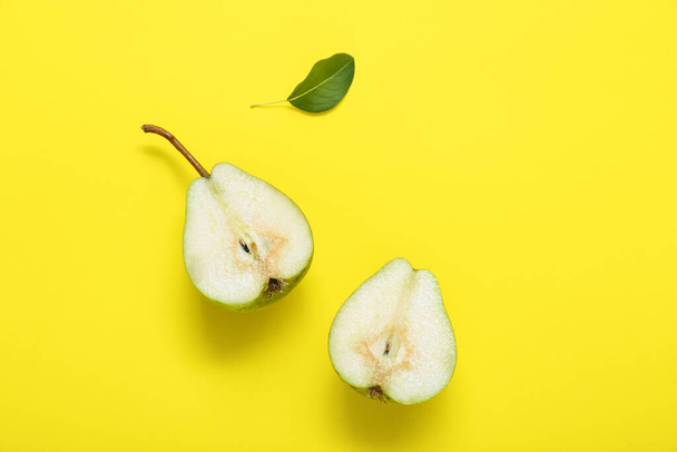 Sliced ripe pear on yellow background - Photo, Image