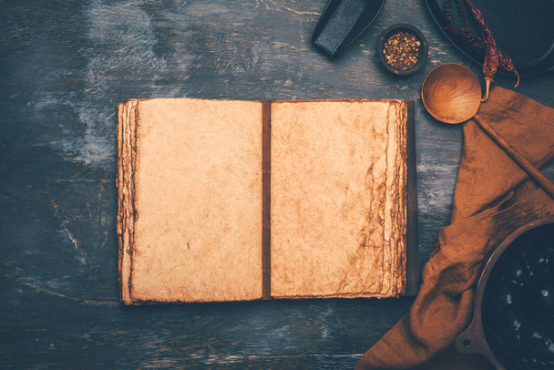 Empty menu or cookbook and kitchen utensils on wooden table, vintage style - 写真・画像