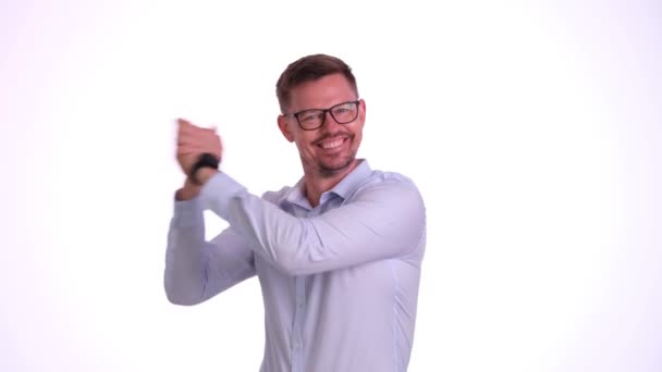 Celebrating businessman gesturing with hands in front of looking at camera and celebrating victory. Success rich career and victory - Footage, Video