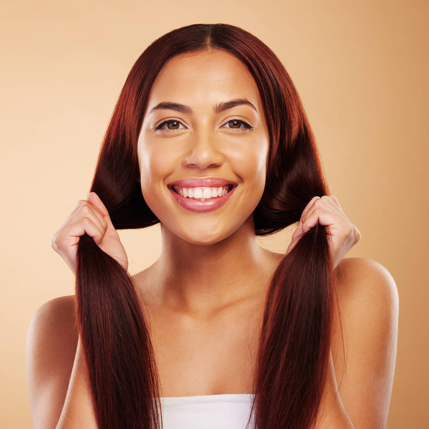 Haircare, beauty and portrait of happy woman with strong hair and luxury salon treatment on brown background. Smile, haircut and shine, face of model with natural cosmetics and makeup glow in studio - Foto, Imagem