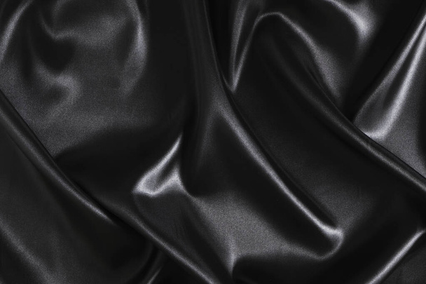 Silk fabric, abstract wavy black satin fabric background - Foto, Imagen