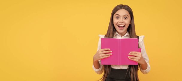 surprised teen girl in school uniform reading book, amasement. Banner of school girl student. Schoolgirl pupil portrait with copy space - Photo, image