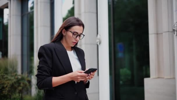 Young businesswoman is in a rush to a meeting, checking her watch - Footage, Video