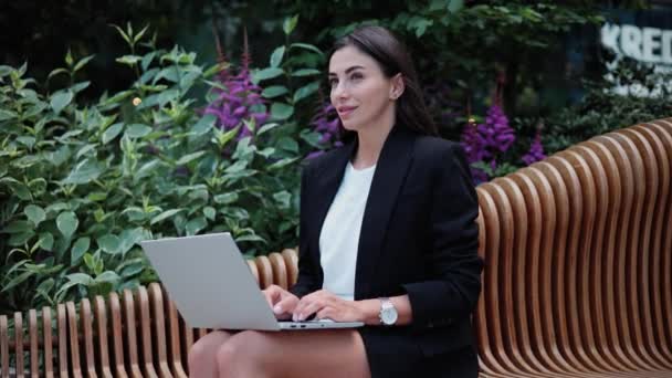 Thoughtful executive female freelancer working on laptop using wifi internet - Footage, Video