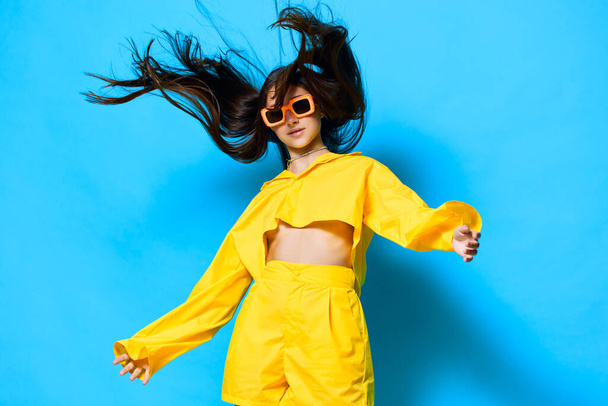 woman attractive lady sunglasses expression gesture girl beautiful stylish caucasian young blue: outfit lovely person modern female trendy style lifestyle fashion yellow - Photo, Image