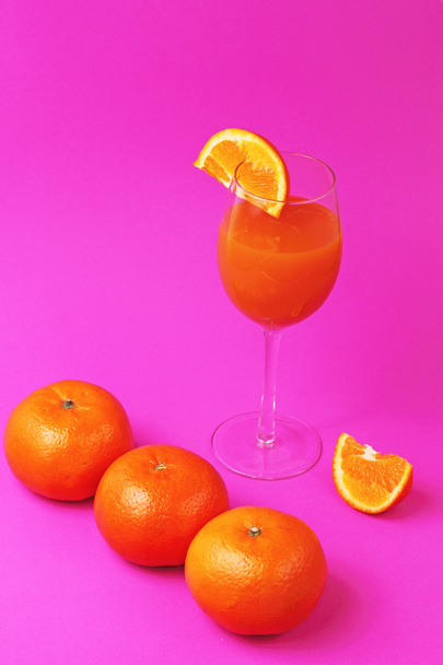 orange juice glass with oranges - Fotó, kép
