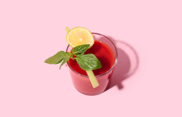 Glass of tasty tomato juice on pink background - Photo, Image