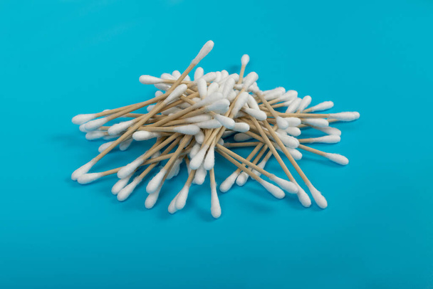 Cotton Swabs, Eco Natural Paper Ear Sticks, Biodegradable Hygiene Bud, Earwax Cleaner Swab, Ear Sticks on Blue Background - Photo, Image