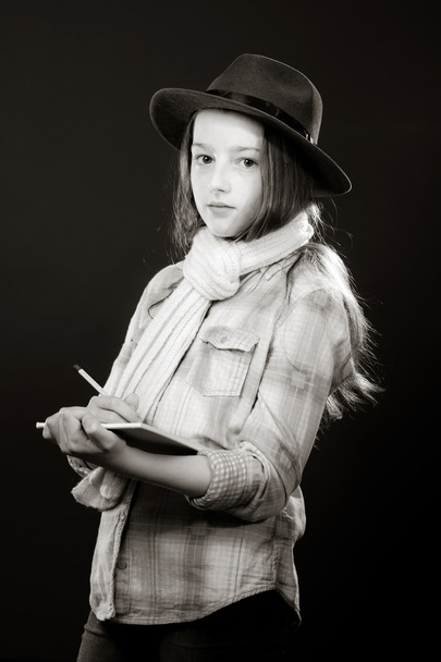 Cute teenage girl with father's hat  close-up portrait - Photo, Image