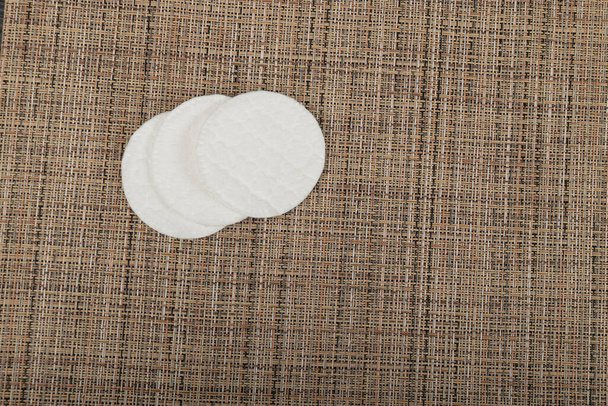 Cotton Disks, Hygiene Pads on Eco Linen Background, Round Facial Sponge, Skin Care Concept, Soft Clear Disk Stack Top View, Copy Space - Фото, зображення