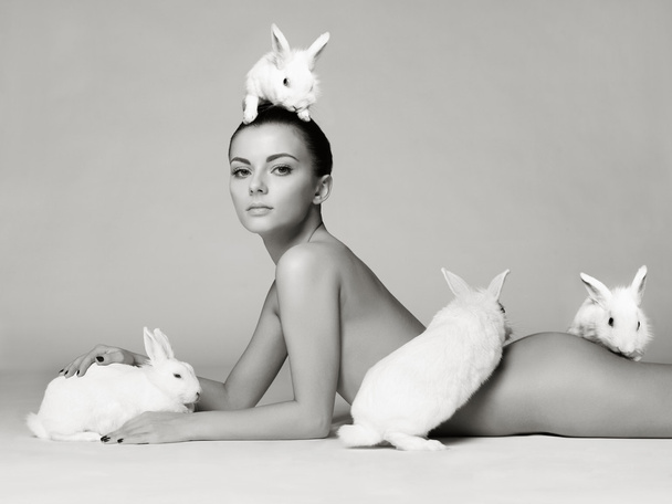 Beautiful woman with rabbit - Foto, afbeelding