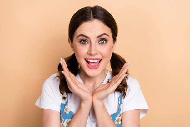 Portrait of young surprised girl perfect beauty face unexpected good news hands cheeks reaction gift isolated on beige color background. - Foto, Imagem