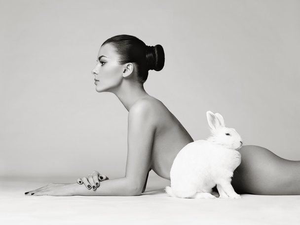 Beautiful woman with rabbit - Фото, изображение