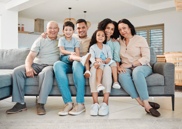 Portrait of grandparents, parents and kids on sofa together, support and love in new home or apartment. Men, women and children on couch, happy smile to relax and generations of family in living room. - Photo, Image