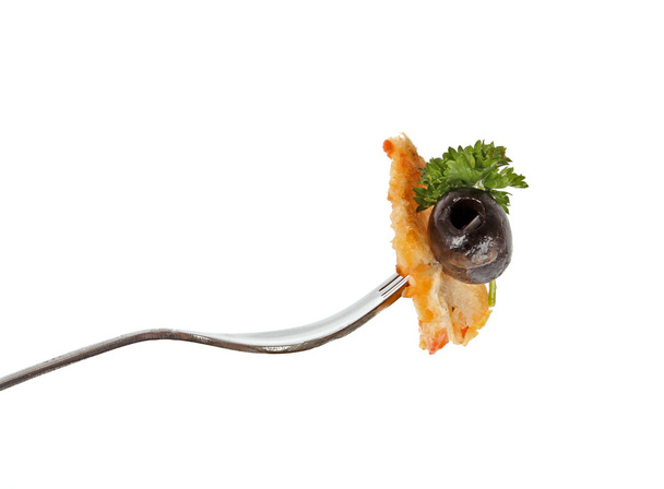 Close up of a fork with Greek salad - Фото, зображення