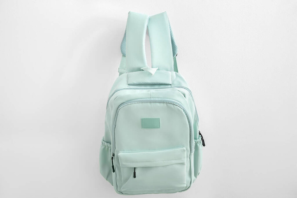 Green school backpack on white background - 写真・画像