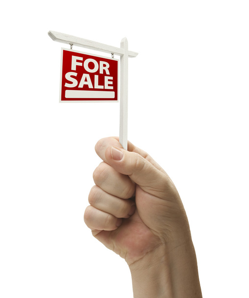zu verkaufen Immobilienschild in der Faust auf weiß - Foto, Bild