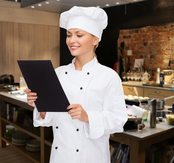 female chef with  blank paper - Foto, Bild