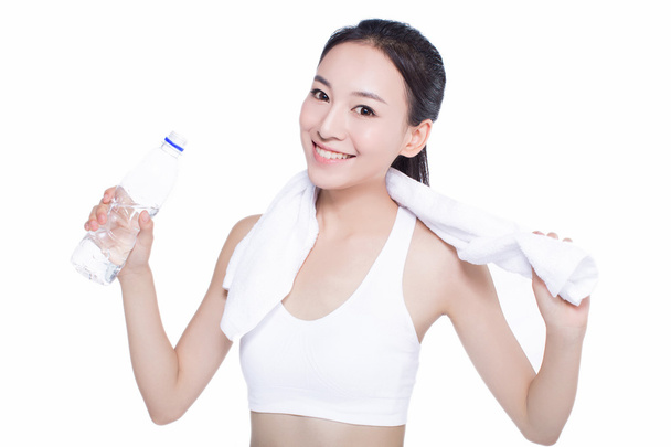healthy asian woman with towel and water bottle - Photo, Image
