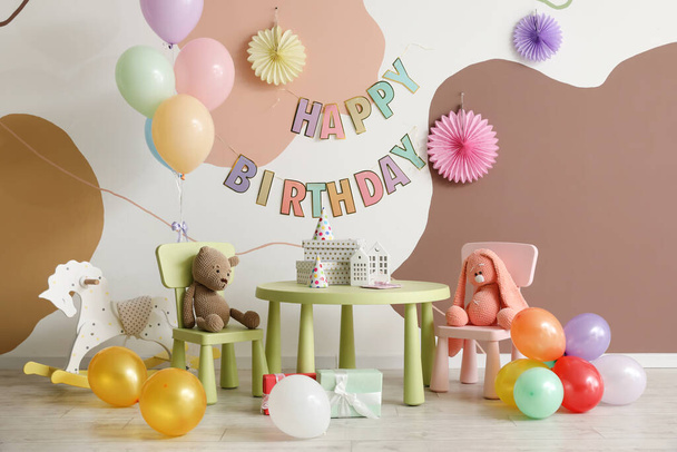 Interior for child's birthday party with balloons, toys and furniture - Фото, изображение