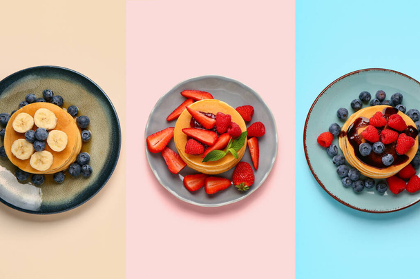 Plates with sweet pancakes and berries on color background - Zdjęcie, obraz